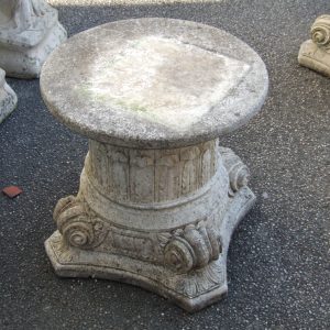 Corinthian style stone plinth