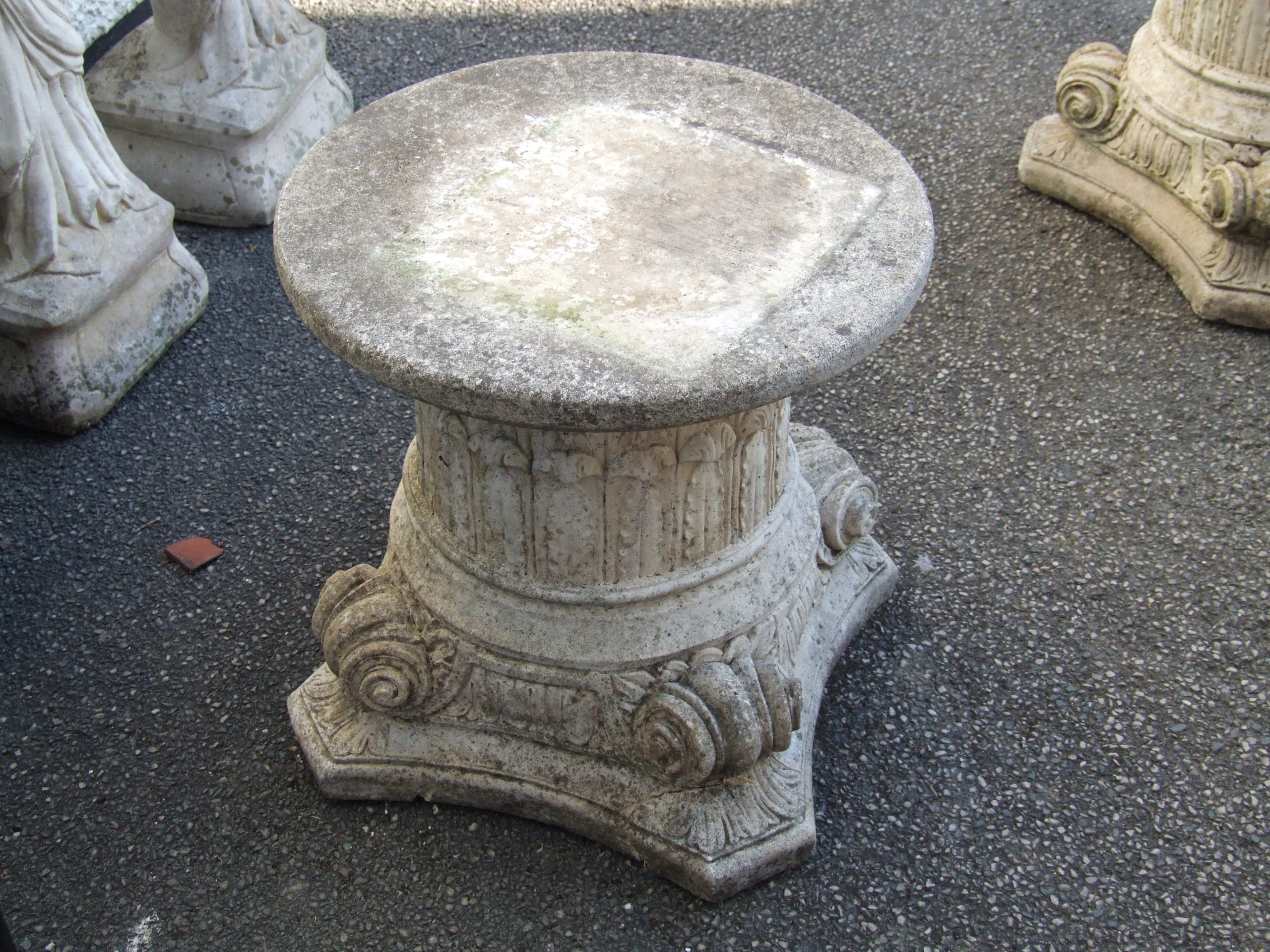 Corinthian style stone plinth